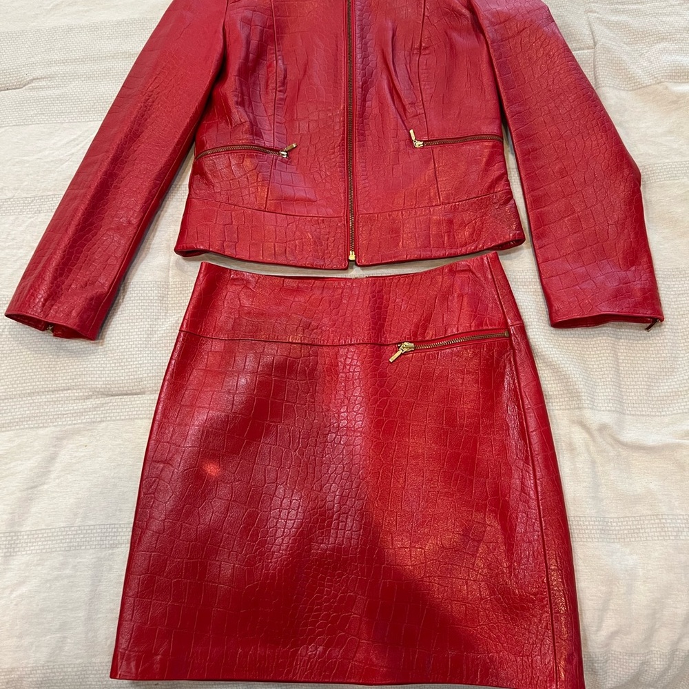 Elegant Cache Red Leather Jacket and skirt set.